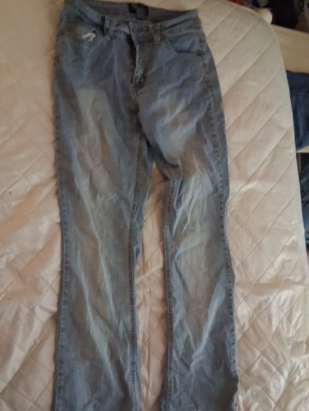 Angels blue denim jeans with rimestones on the back pockets